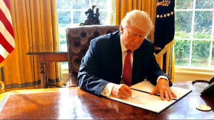 Trump signs new immigration order excluding Iraq