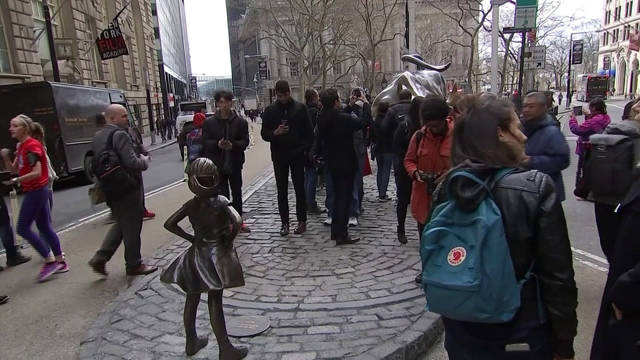 'Fearless Girl' statue stares down Wall Street's iconic bull