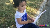 Toddler learning ABC Alphabets on a White Flags _ Fun outdoors park-nQ