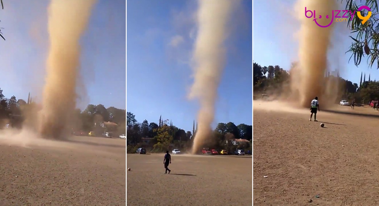 Mini tornade de poussière au milieu d'un terrain de foot