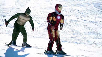 Superhero winter sliding down on snow tubes and skiing - Joker, Spiderman, Ironman, Hulk,