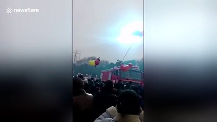 Bunch of balloons stuck on power lines causes huge spark