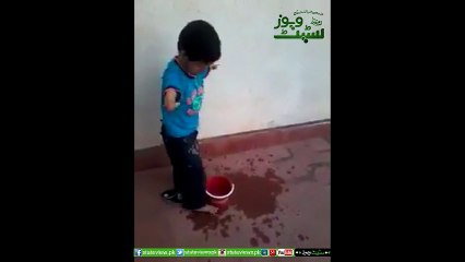 A Young Boy Without Arms Taking Ablution