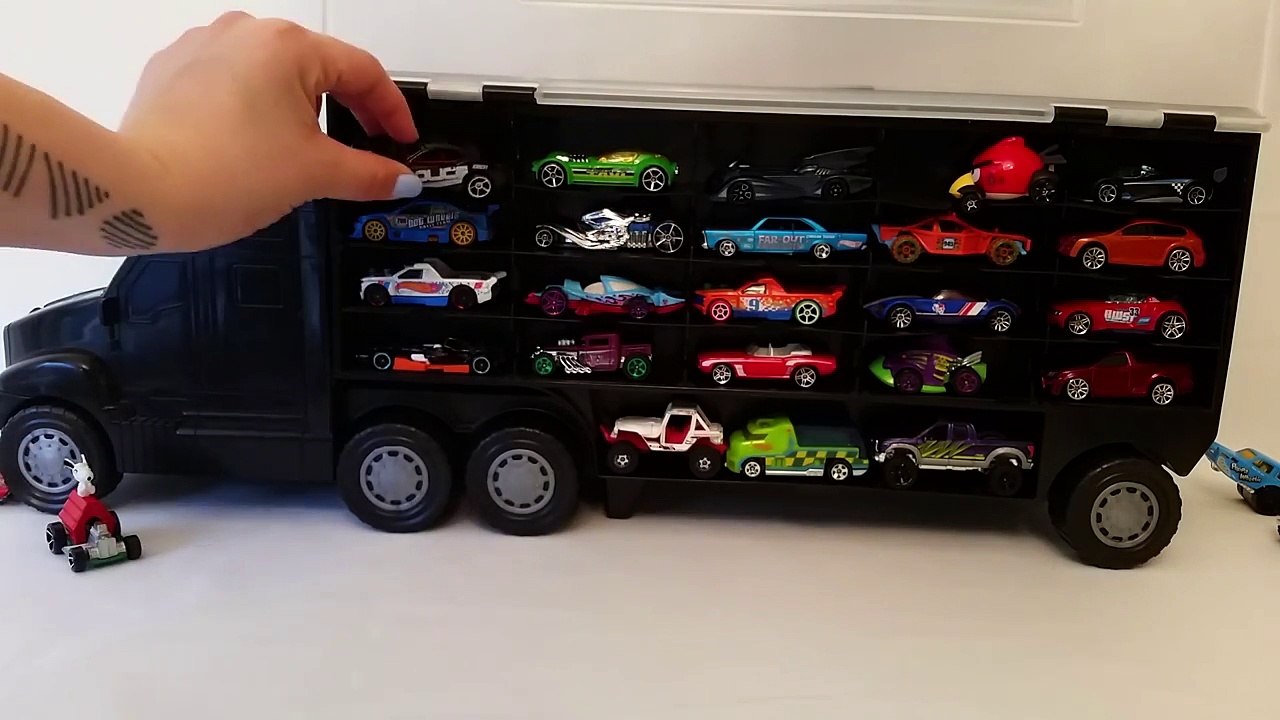 Hot Wheels Transporter and 40 Cars! Video for kids about the toy transporter. Truck and ca