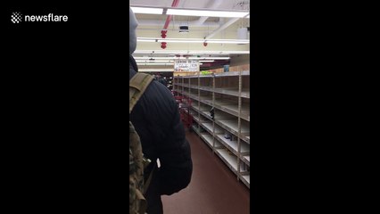 Long queues and empty shelves at supermarket before storm Stella