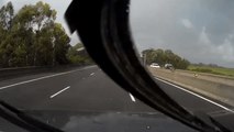 Corrugated Iron Sheets Fly Into Traffic During Rain Storm