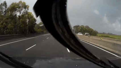 Corrugated Iron Sheets Fly Into Traffic During Rain Storm