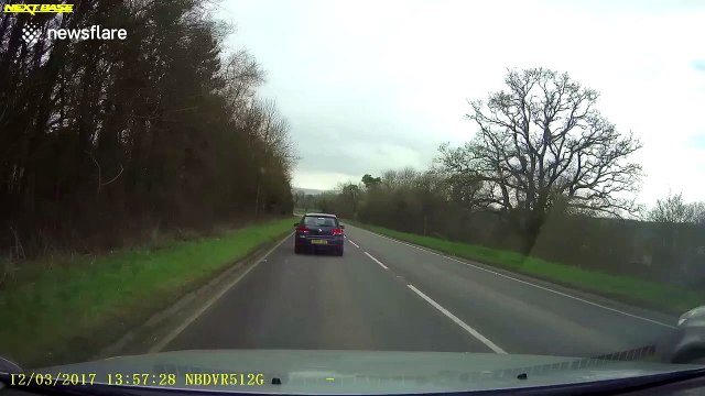 Driver narrowly avoids hitting oncoming car in dangerous overtake
