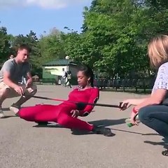 This 22-year-old girl limboes under a car that's only 8 inches off the ground 