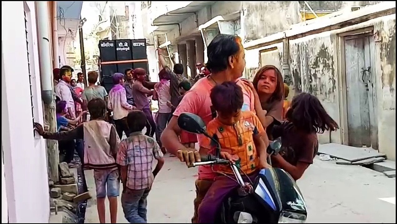 People Playing And Dancing with Colors on the Festival of Colors