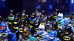 Batman Convention with Superman Saving Different People Wearing Superhero Batman Costumes