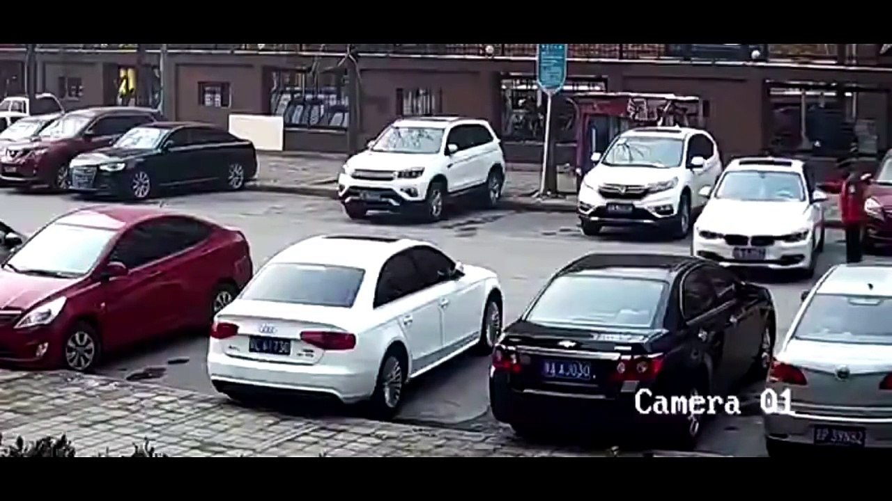 White BMW hits Black Chevy Out of Parking Space