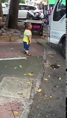 Little kid with knife threatens driver who wants to park