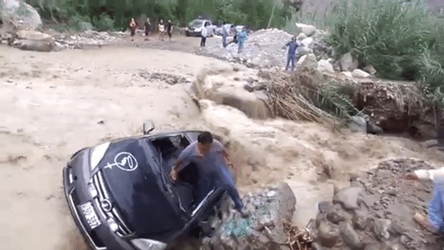 Man Escapes From Car Stuck in Floodwaters