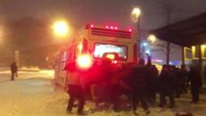 'Snow' Big Deal as Commuters Join Forces to Move Stuck Buses