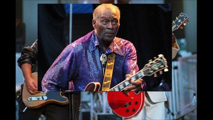 Bruce Springsteen and Chuck Berry laugh as they perform the