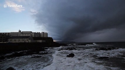 Ominous storm sweeps across the sea off Northern Ireland