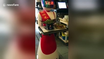 Robot serves customers in Chinese restaurant
