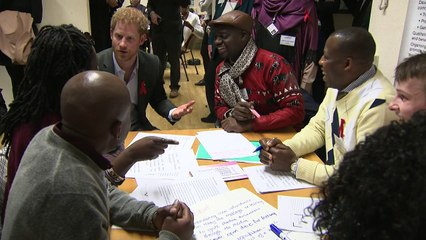 Prince Harry serves up lunch on visit to HIV charity