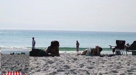 Girls can't stop laughing on the beach