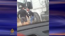 Israeli policeman caught on video beating Palestinian truck driver