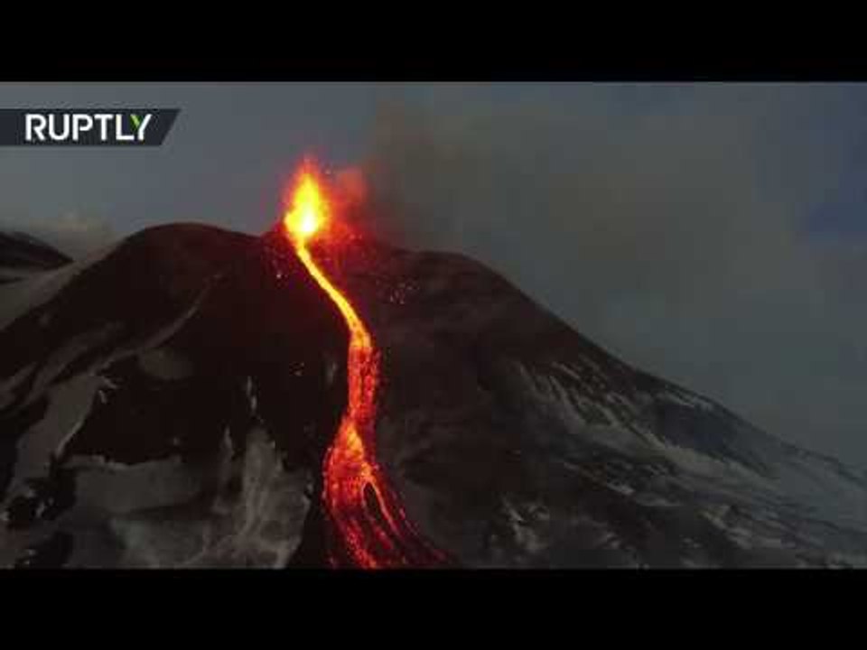 Eruption fly-over: Mount Etna spewing lava & smoke, captured from drone