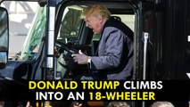 President Donald Trump climbs into an 18-wheeler
