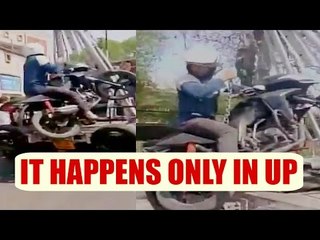 UP police towed motorcycle with man sitting on it, Watch Shocking video | Oneindia News