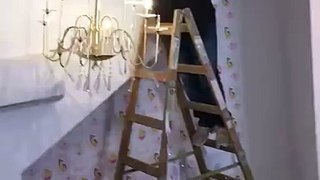 Chandelier, Ladder, Man all crash and fall. Epic Fail.