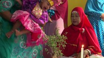 In golden crown, Indonesian girl howls through circumcision