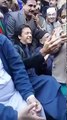 Imran Khan helping his young fans take selfies with him
