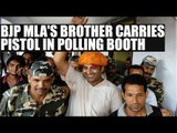 Sangeet Som's brother, Gagan Som, detained  for carrying pistol in polling booth|Oneindia News
