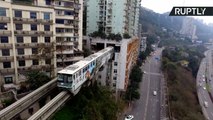 Forget Noisy Neighbors, Chinese Train Literally Runs Straight Through Block of Flats