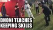 MS Dhoni teaches wicketkeeping skills at Virender Sehwag's school, Watch Video | Oneindia News