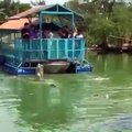 These tourists climb on a weak raft and cross a lake full of hungry crocodiles
