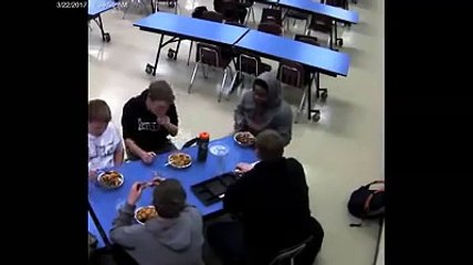 Student saves friend from choking.
