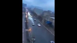 The astonishing moment lightning hits a car and sends it flying along the road at high speed
