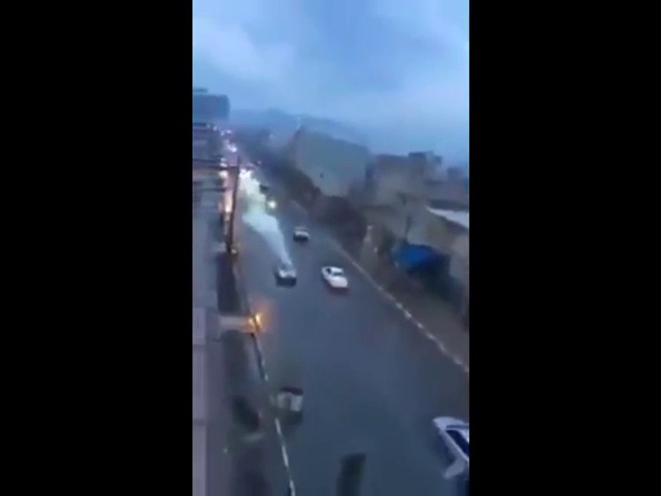 The astonishing moment lightning hits a car and sends it flying along the road at high speed