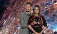Justin Timberlake grabbing Mila Kunis on stage