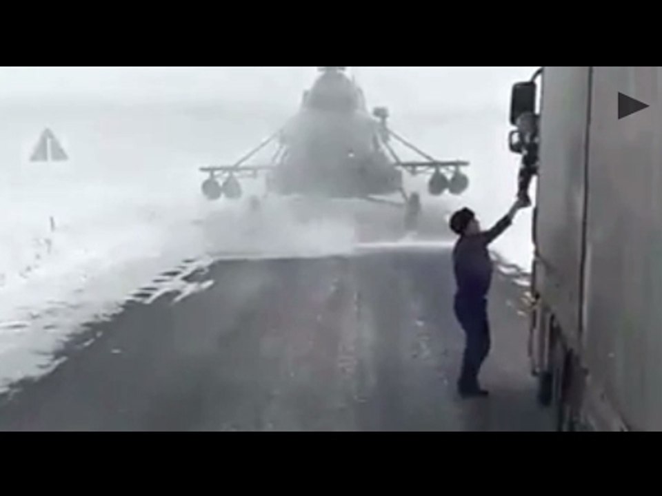Military helicopter pilot asks for directions after landing on a road in Kazakhstan