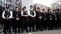 Police officers and civilians pay tribute to victims of Westminster terror attack