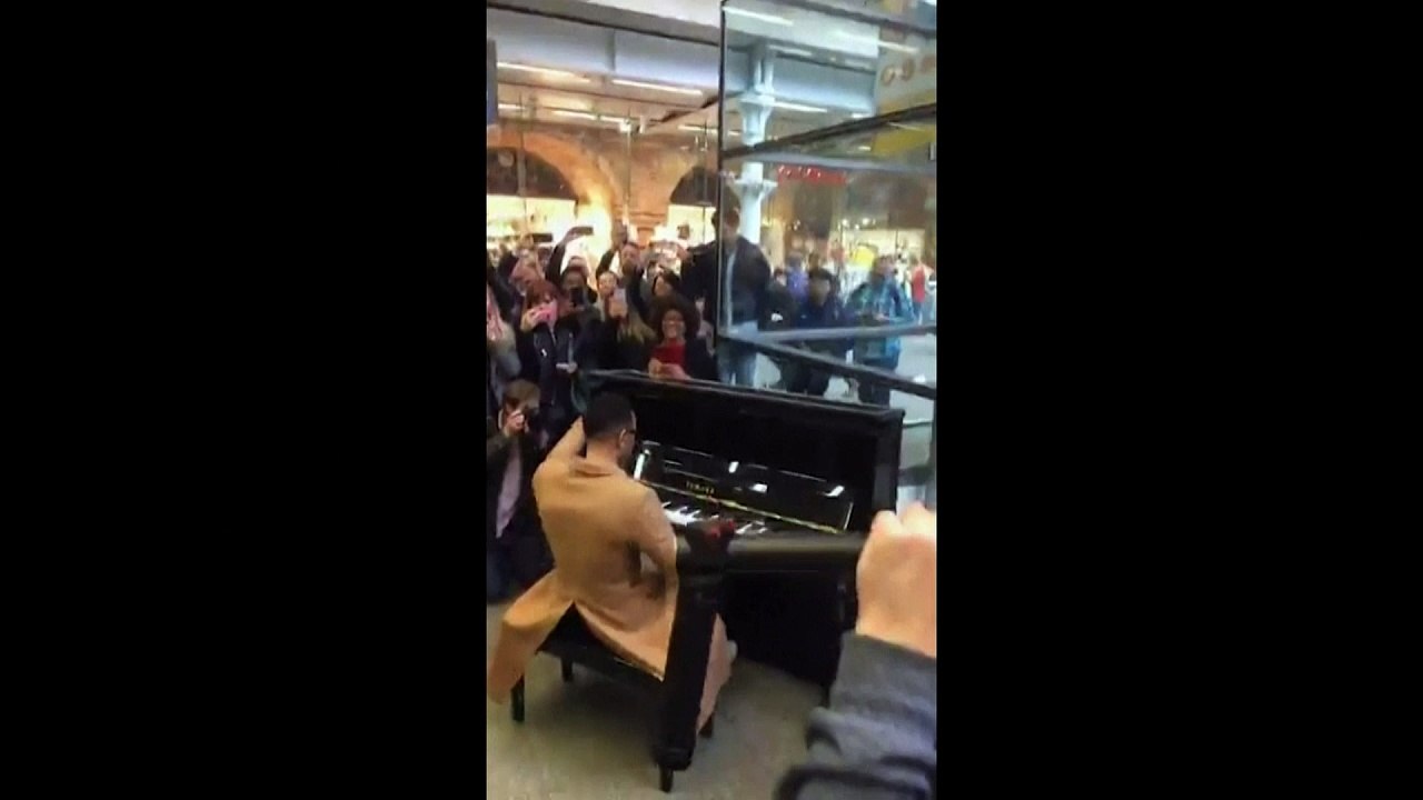 John Legend surprises commuters with performance