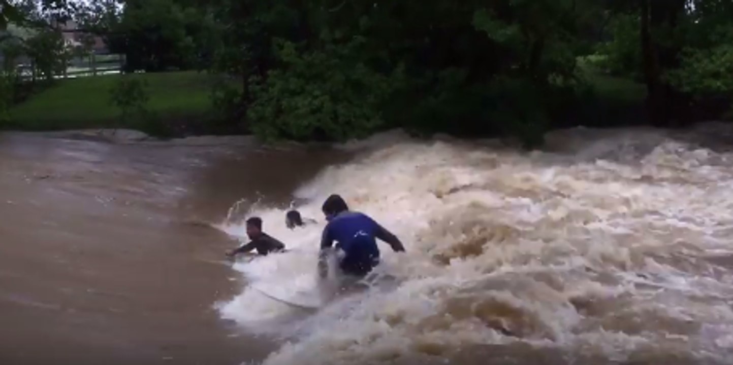 Thrill-seeking Surfers Dive Into Raging Floodwaters at Murwillumbah Weir