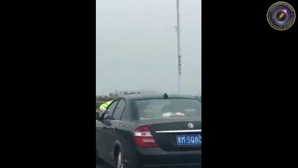Car with police officer on hood runs on highway [Policam USA]