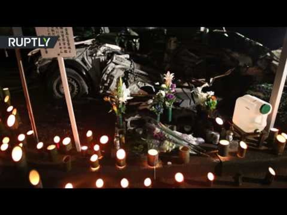 Fukushima residents hold vigil paying tribute to victims of 2011 earthquake & tsunami