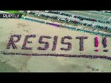 More than 1,000 gather on San Francisco beach to spell ‘RESIST’ in anti-Trump protest