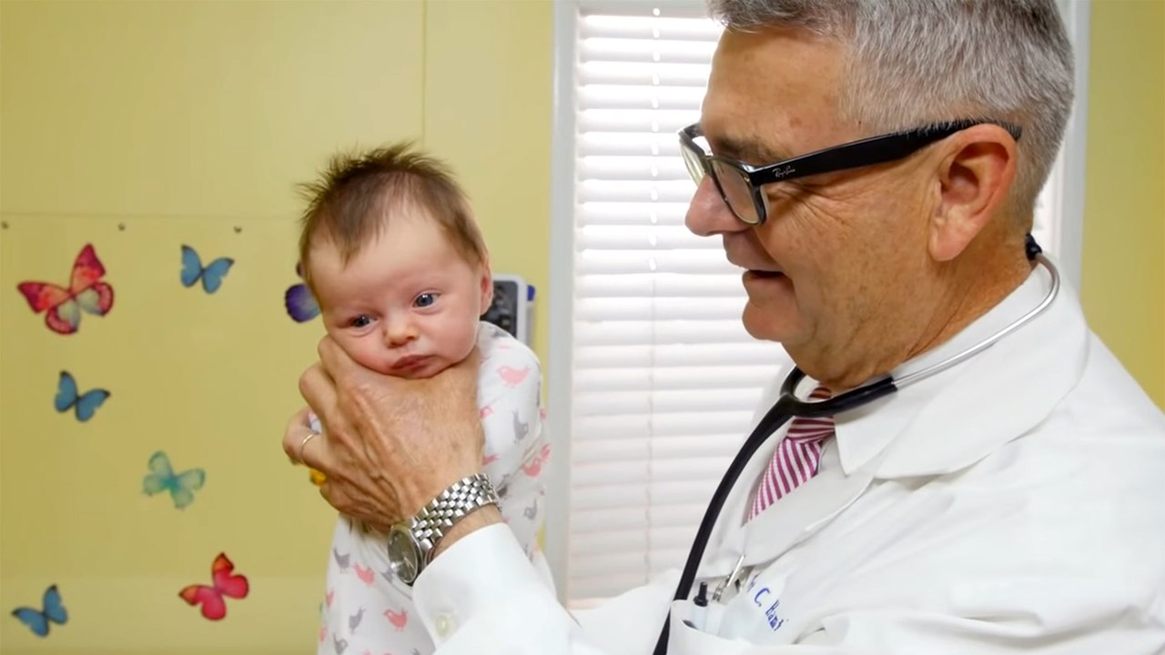 How To Calm A Crying Baby - Dr. Robert Hamilton Demonstrates -The Hold