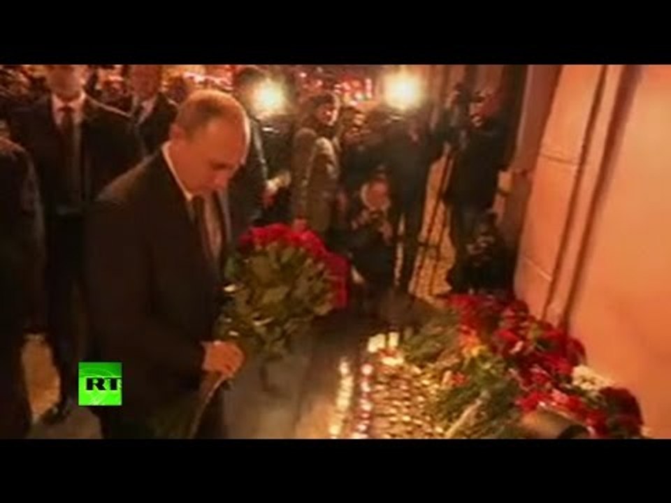 Putin lays flowers at vigil site for St. Petersburg blast victims