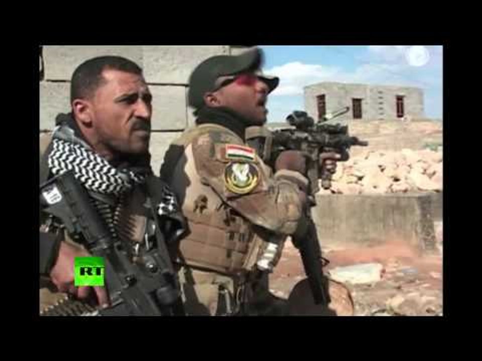 Iraqi troops backed by US-led airstrikes fired at ISIS militants in a neighbourhood of Ramadi