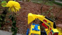 Excavators for kids _ Baby playing excavators destructive the yellow flowers   Toy for children-1jKx